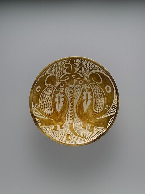 Bowl with two facing peacocks, probably Basra, 10th century CE (The Met, 64.134)